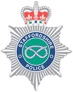 Staffordshire Police badge with crown, rope knot, and starburst design.